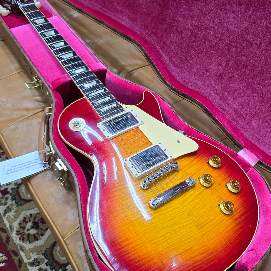 Gibson Les Paul electric guitar in Washed Cherry Burst finish, displayed in its case.