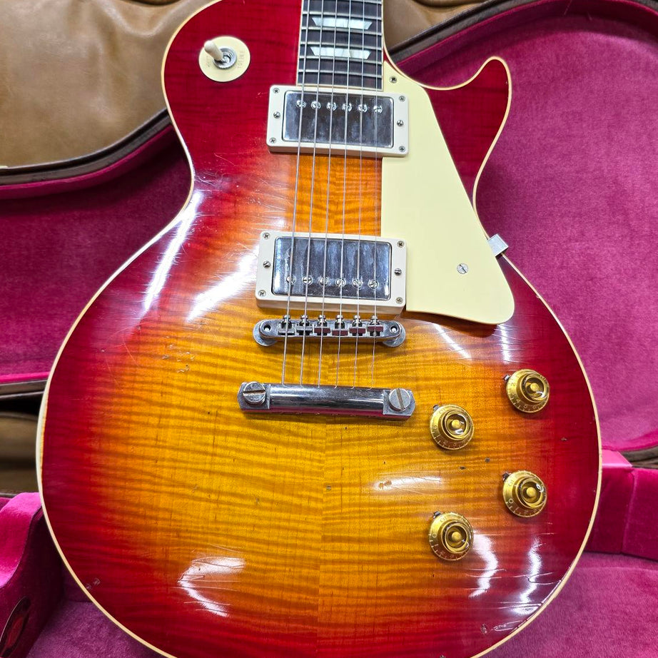 A pre-owned Gibson Les Paul R9 electric guitar in Washed Cherry Burst finish, displayed in its case.