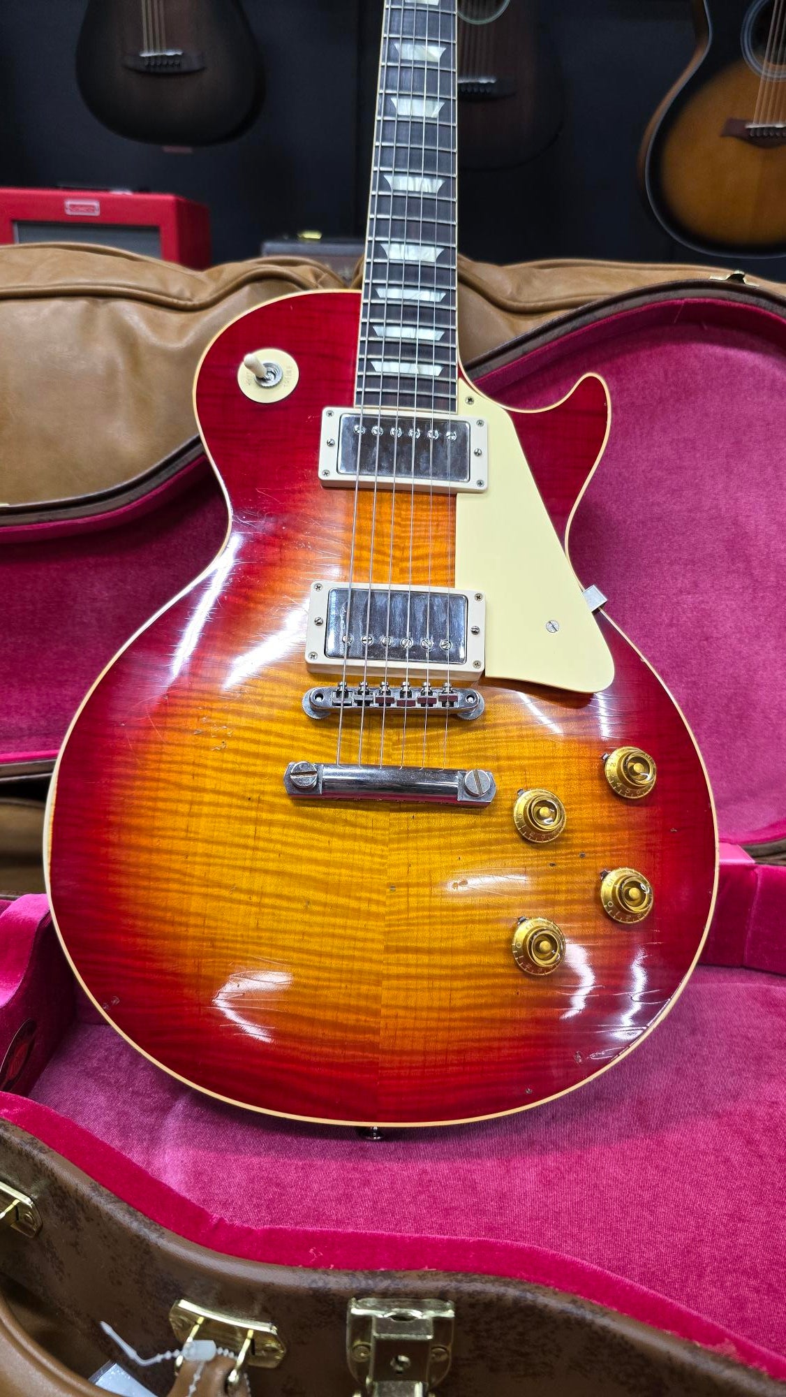 A pre-owned Gibson Les Paul R9 electric guitar in Washed Cherry Burst finish, displayed in its case.