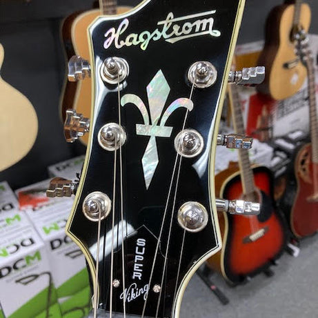 Hagstrom Super Viking Semi-Hollow Guitar in Wild Cherry Transparent Gloss Articulate. Expressive. Aggressive.